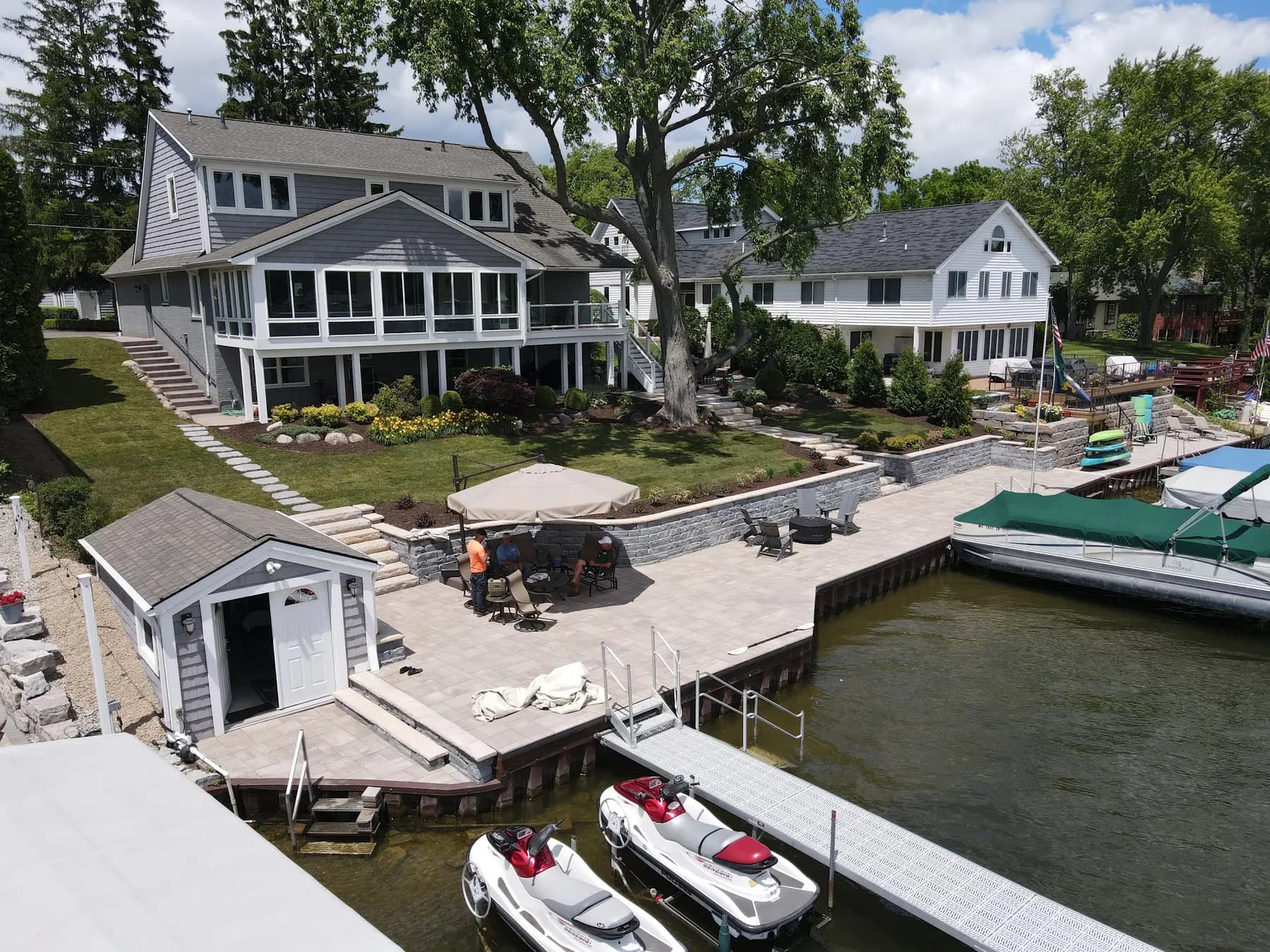 Aerial view of retaining walls, patios and docks on a lakefront property