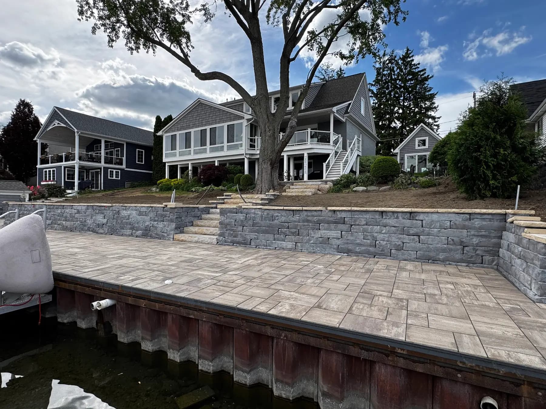 Paver patio and retaining wall along a seawall
